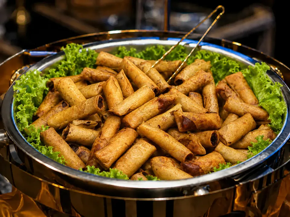 Crispy lumpiang Shanghai arranged in a chafing dish